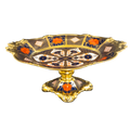 Decorative tray with gold, blue, and orange patterns on a white background