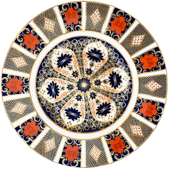 A round decorative plate with an intricate floral and geometric pattern in navy blue, white, gold, and rust red, set against a plain white background.