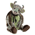 Charlie bears mock turtle - a stuffed toy resembling acombination between a cow and a turtle with green and brown collors wearing a black floral tie
