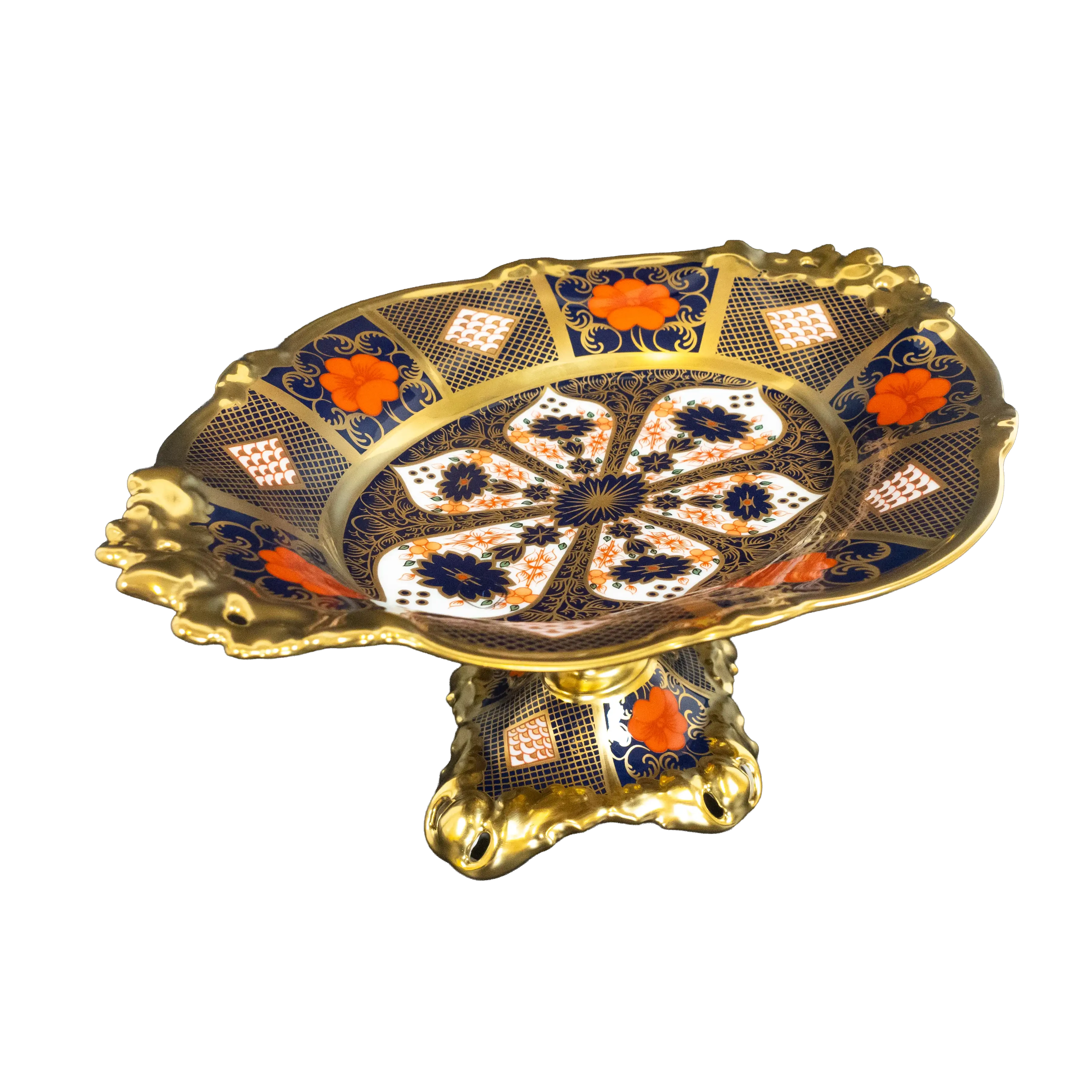 Decorative ceramic plate with gold and blue patterns on a white background