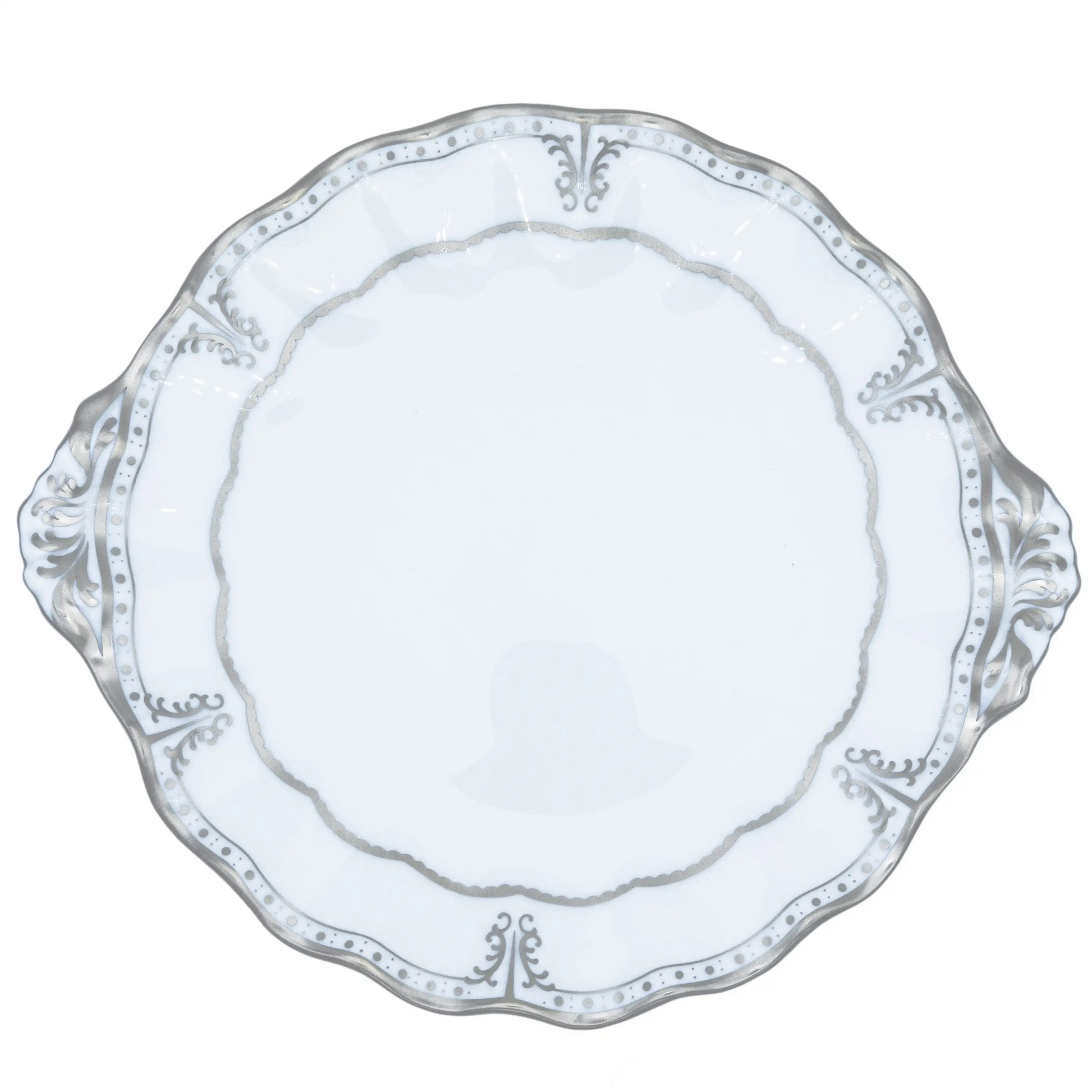 Decorative white plate with intricate patterns on a white background