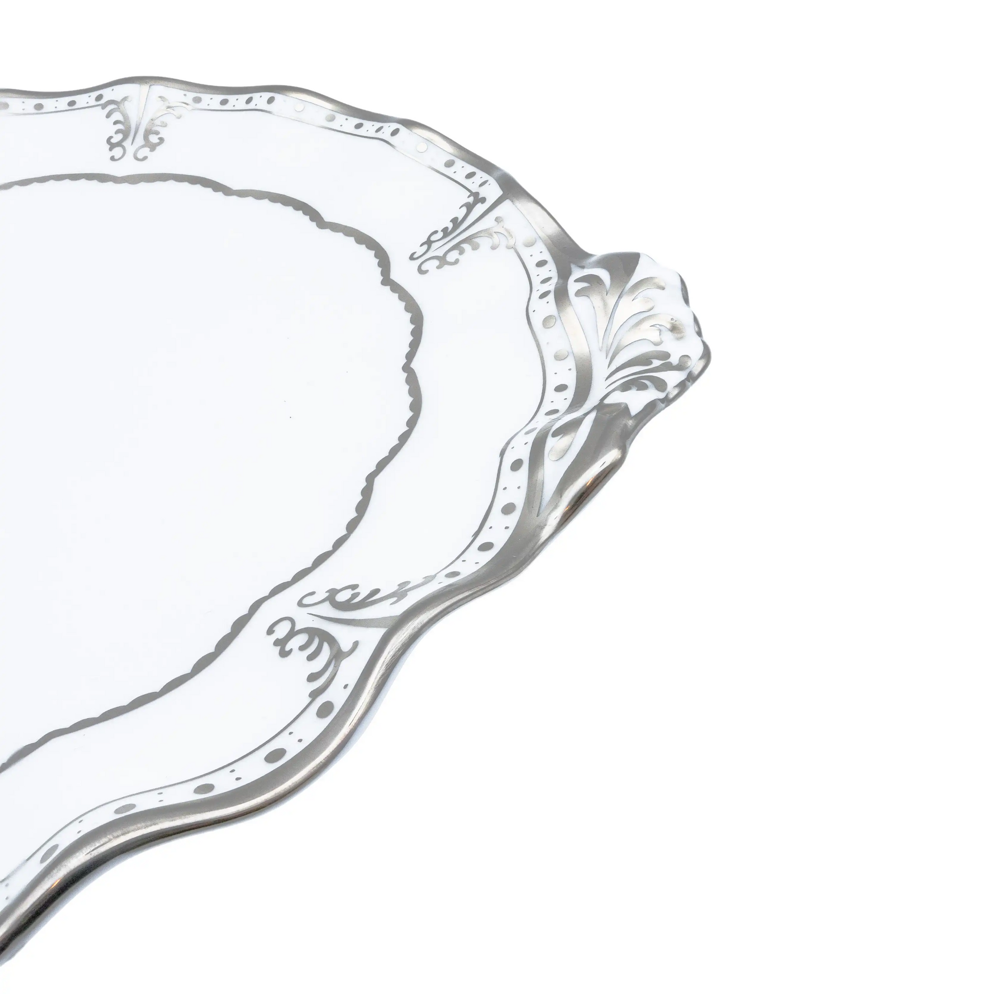 Decorative silver tray with intricate designs on a white background