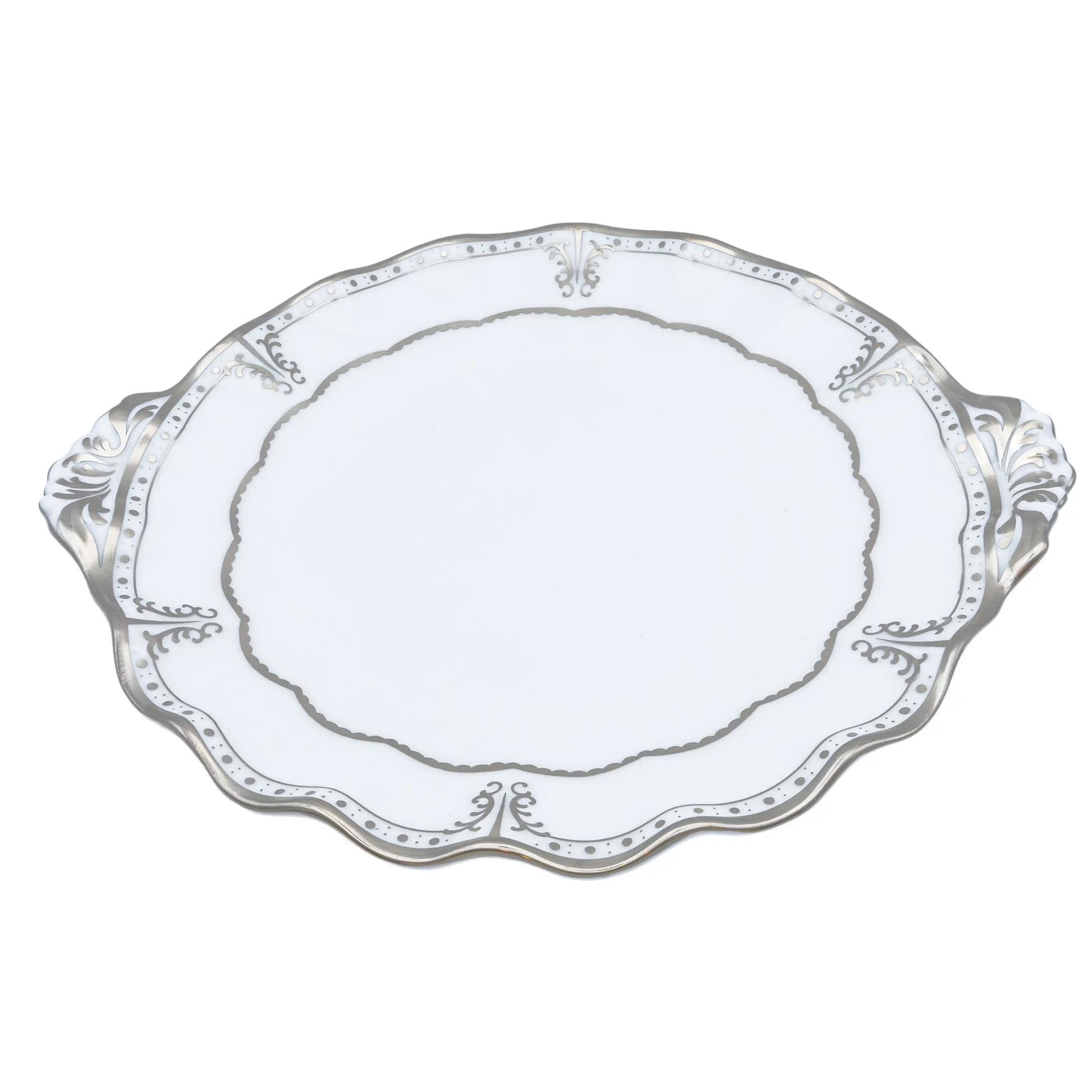 Decorative white plate with intricate patterns on a white background