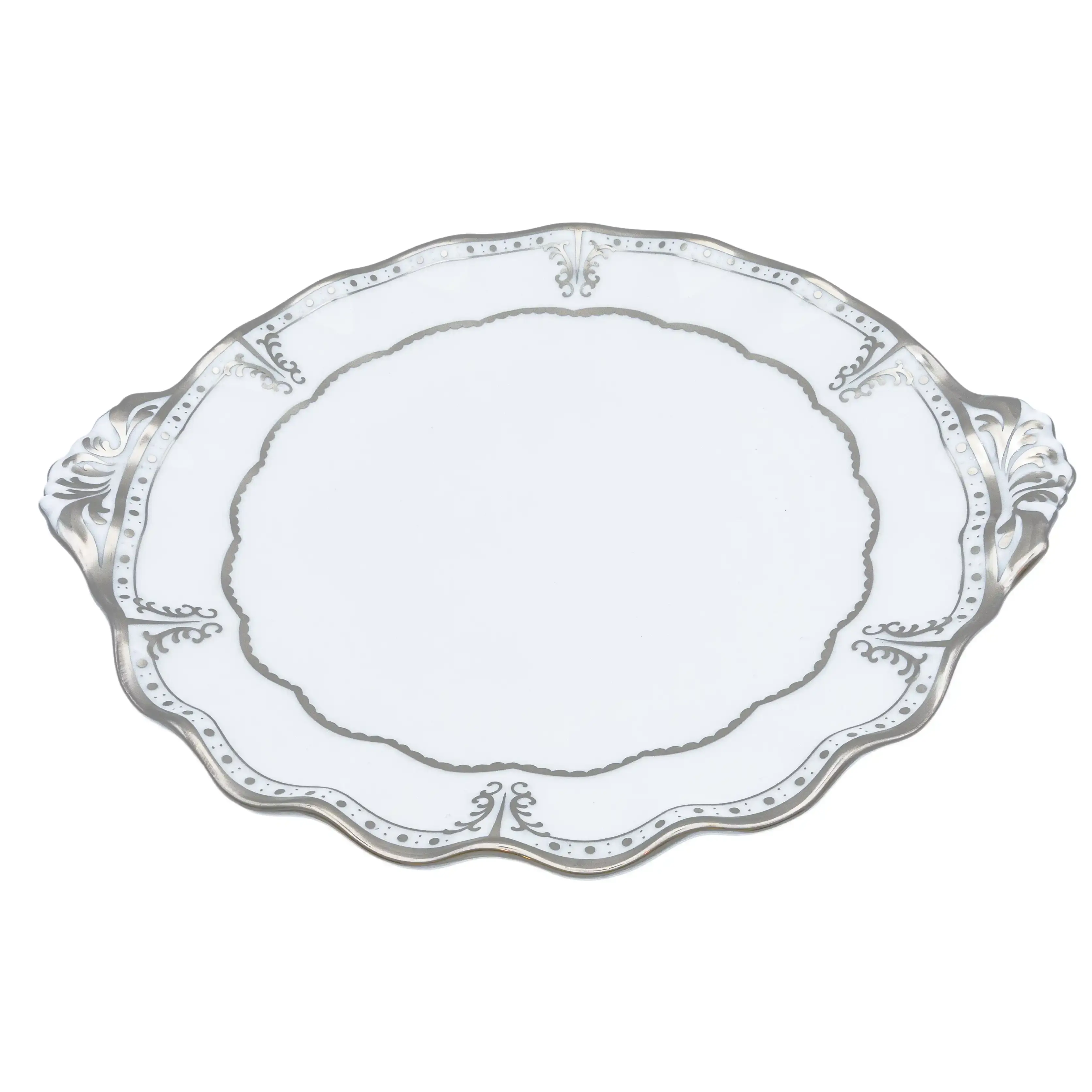 Decorative white plate with intricate patterns on a white background