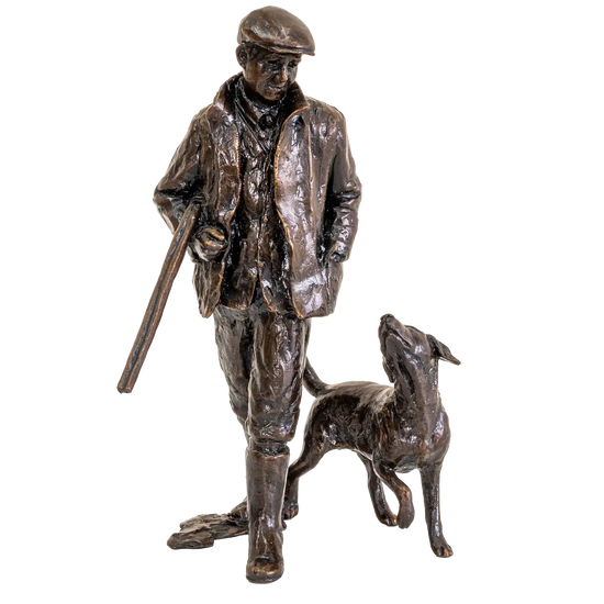 Bronze statue of a man with a dog on a white background