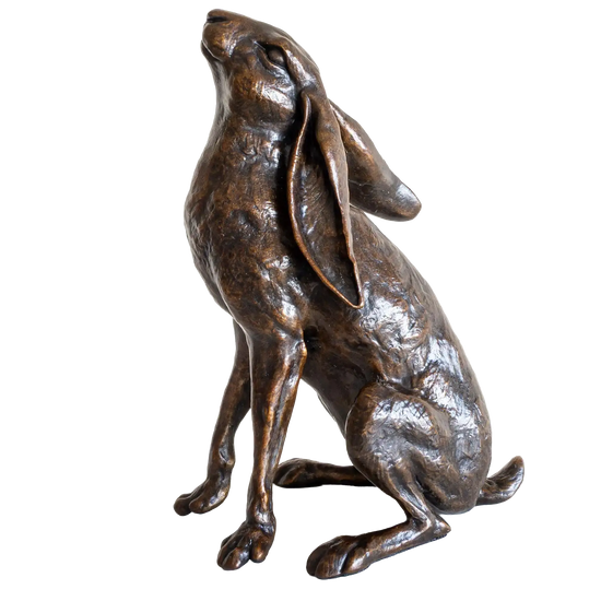 Bronze statue of a rabbit on a white background
