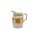 Decorative ceramic pitcher with floral patterns on a white background