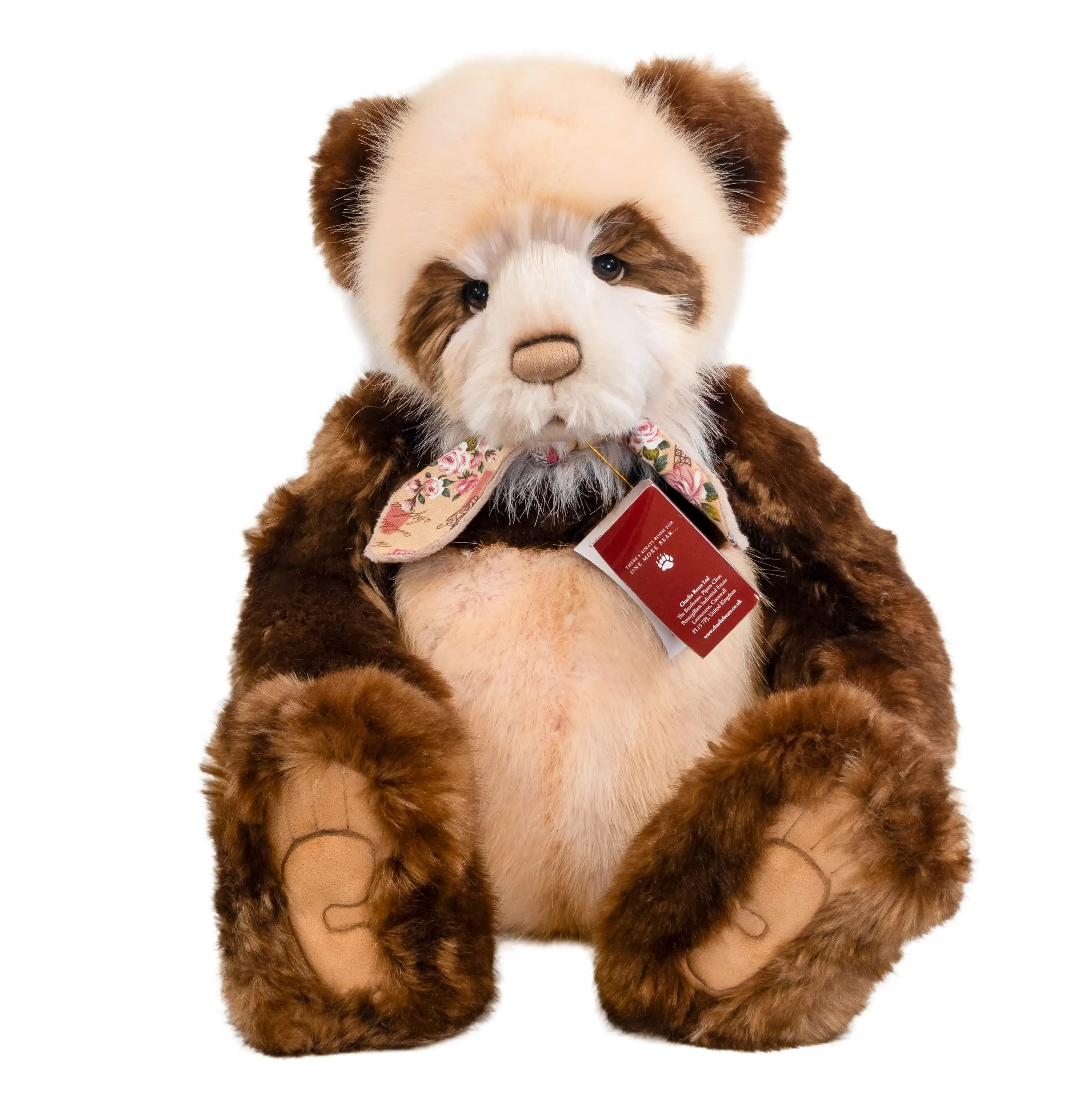 Plush panda bear with a tag on a white background