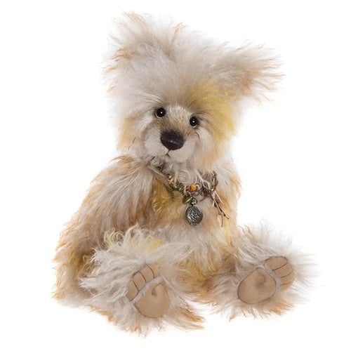 charlie bears mizmaze - a brown fluffy teddy bear wearing a necklace with multiple charms
